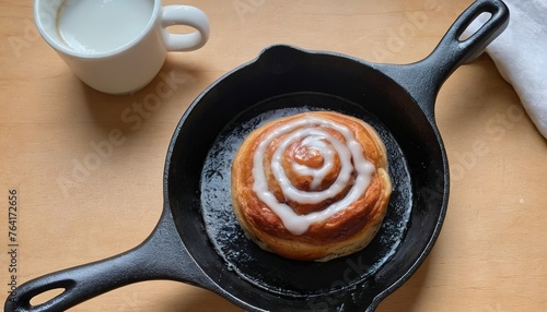 Cinnamon bun for one in a tiny cast iron skillet