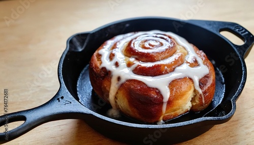 Cinnamon bun for one in a tiny cast iron skillet