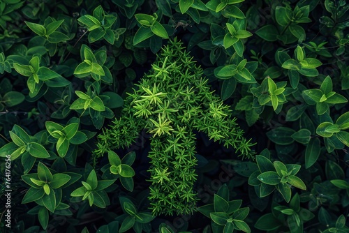 A vibrant green up arrow symbol, crafted from lush grass, representing sustainable growth