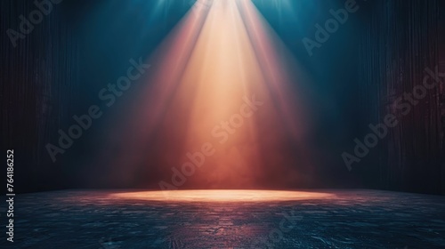 Motivational environment, a single, bright light source illuminating an empty stage photo