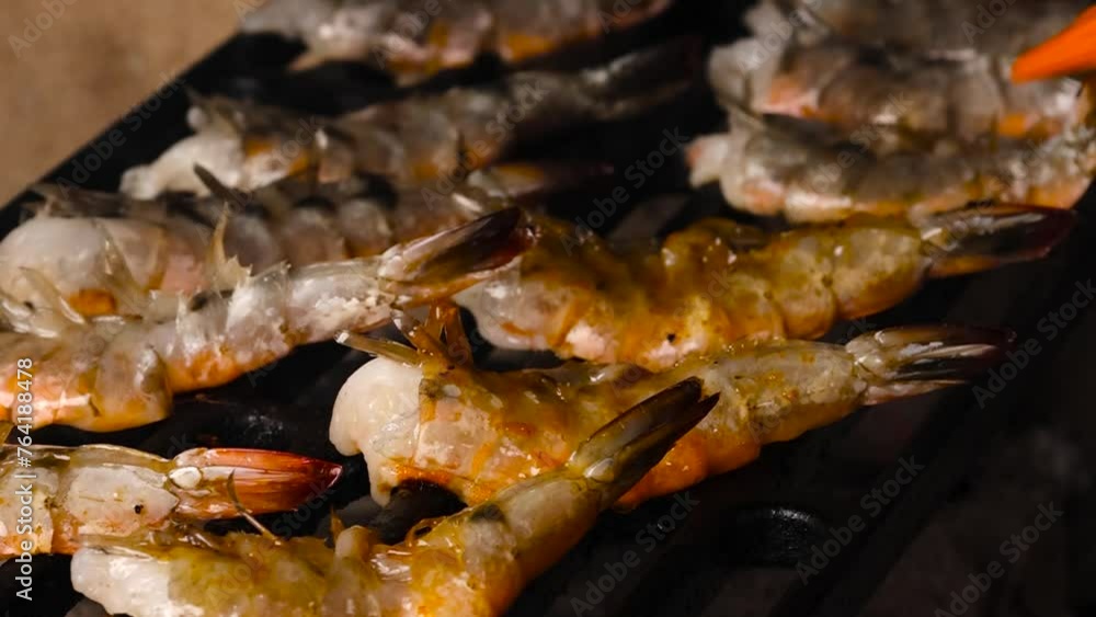 shrimps that are grilled are spread with red sauce with a brush close up asia kitchen japan asian food shrimps that are grilled are spread with red sauce with a brush close up asia kitchen japan asian food