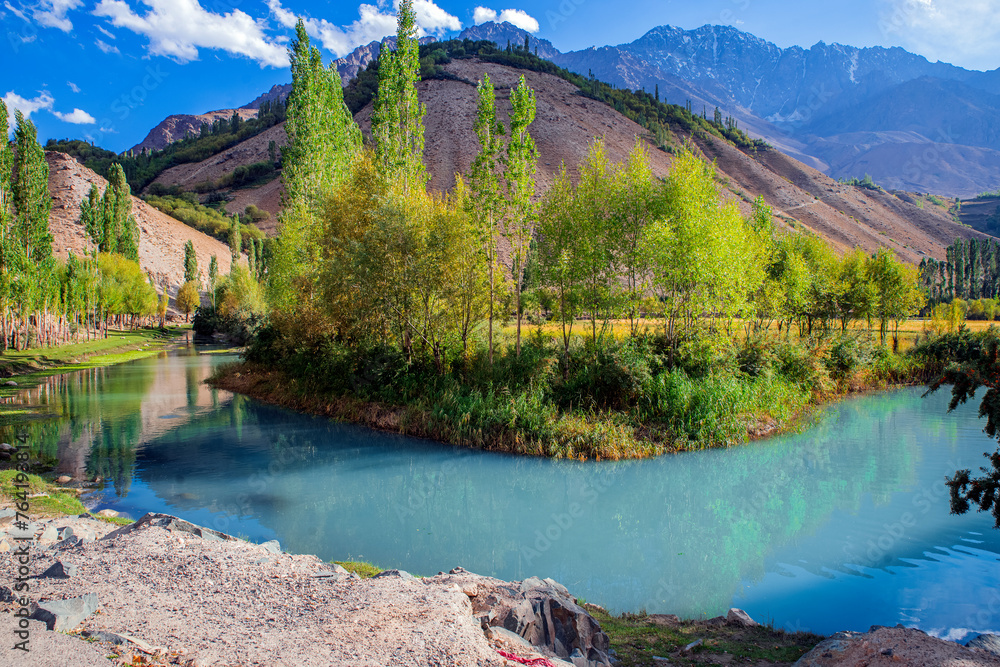 Beautiful lake surrounded by green mountains and trees Beautiful lake surrounded by green mountains and trees