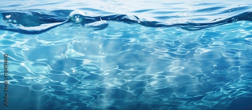 An image showcasing a close-up view of the water surface with the sunlight shining through