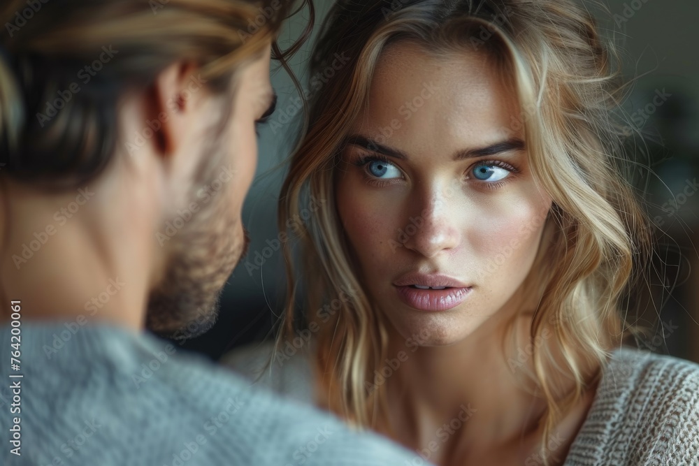 A pair of young adults exchange intense gazes, showing connection and unspoken emotions A pair of young adults exchange intense gazes, showing connection and unspoken emotions