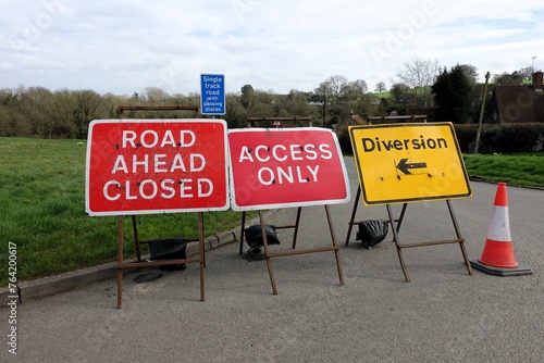 Road ahead closed, access only and diversion signs