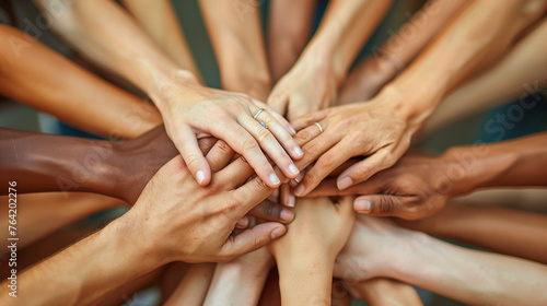 essence of solidarity with a close-up image of diverse hands clasped together in unity, symbolizing teamwork, collaboration, and strength. photo