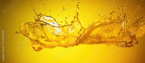 A focused view of liquid splashing on a vivid yellow surface