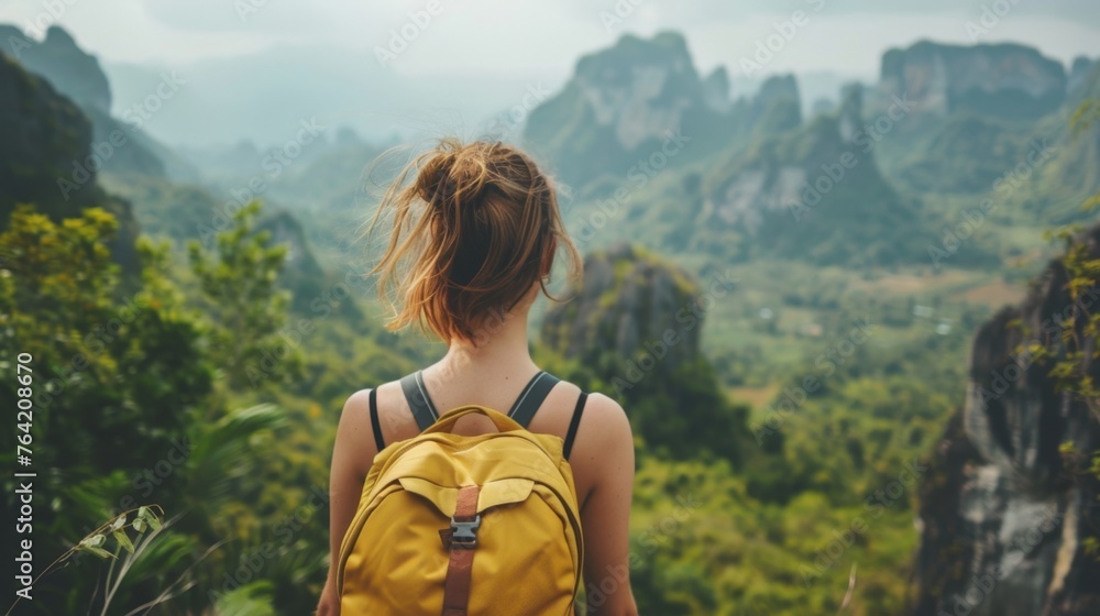 Woman With Yellow Backpack Admiring Mountains Woman With Yellow Backpack Admiring Mountains