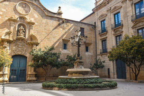 Plaza de obispo in Solsona, Catalunya Spain, with the fountain and the lamp in the middle of the square © S J Lievano