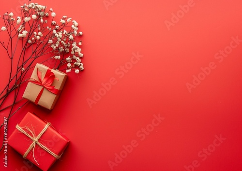 Elegant Festive Gifts Wrapped with Red Ribbon on Vibrant Red Background