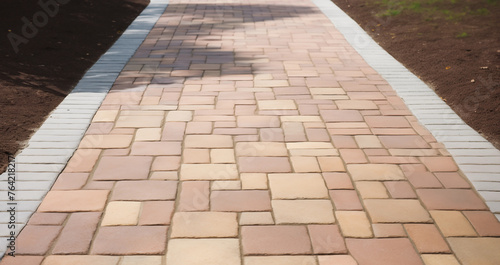 Cobblestone walkway background image; resource for landscaping company