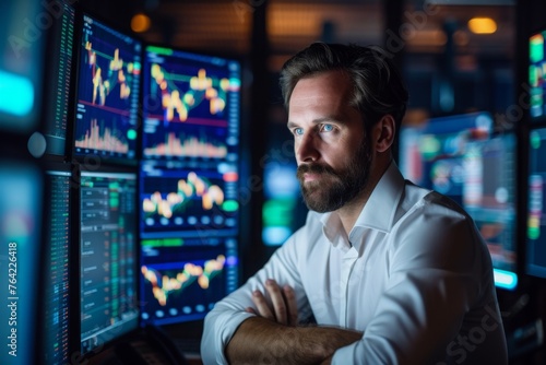 A man wearing a white shirt is focused on looking at the screen of a computer in front of him, Confident man surrounded by screens displaying real-time stocks in a trading room, AI Generated