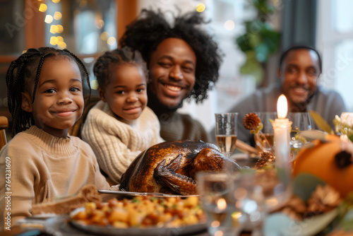 Family enjoying Thanksgiving dinner with turkey and festive decorations