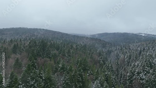 Natural landscape of misty mountains and forest. Winter time