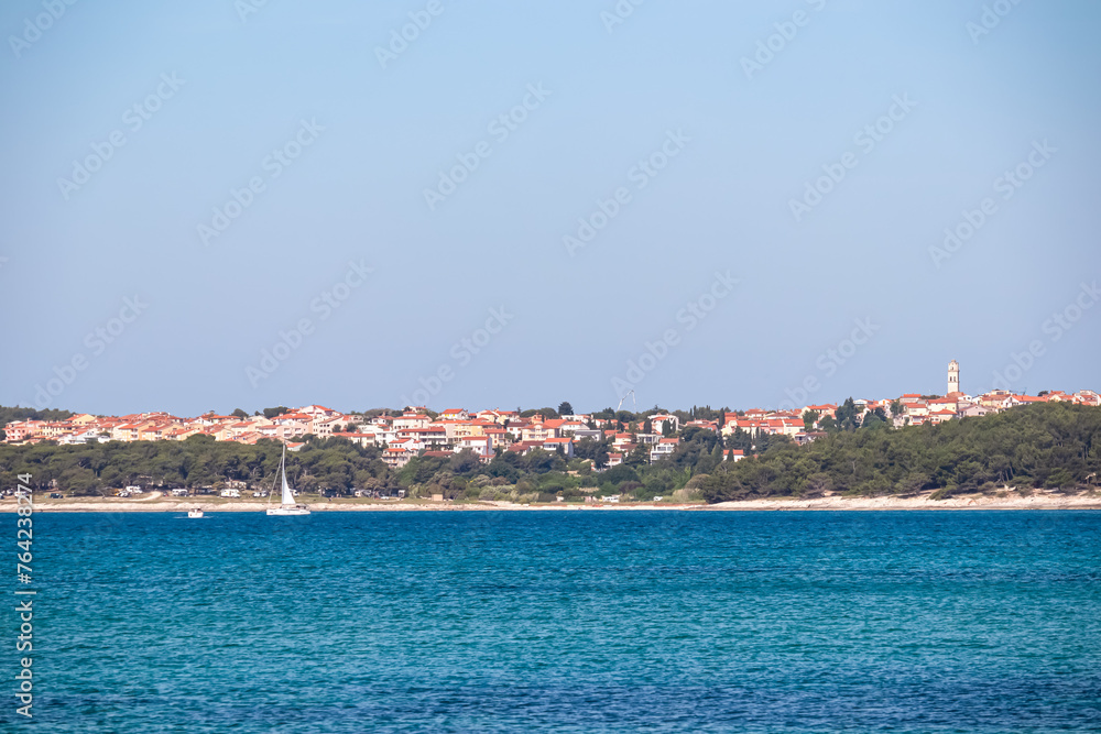 Panoramic view of coastal town Premantura seen from Medulin, Istria peninsula, Croatia, Europe. Idyllic coastline of Kvarner Gulf in Adriatic Mediterranean Sea. Travel destination in summer. Vacation