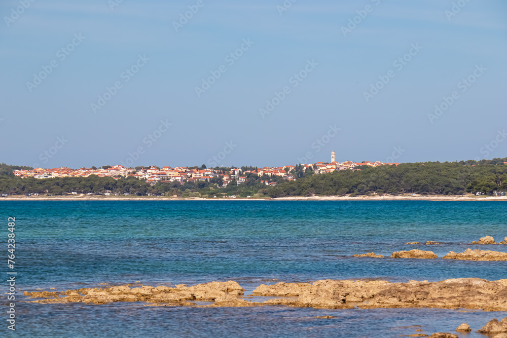 Panoramic view of coastal town Premantura seen from Medulin, Istria peninsula, Croatia, Europe. Idyllic coastline of Kvarner Gulf in Adriatic Mediterranean Sea. Travel destination in summer. Vacation