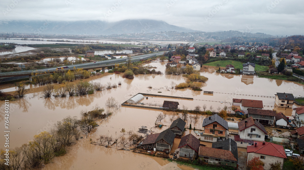 Aerial drone view of torrential rain causes flash floods in residential ...