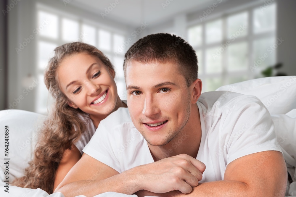 Morning, happy couple  relax on bed