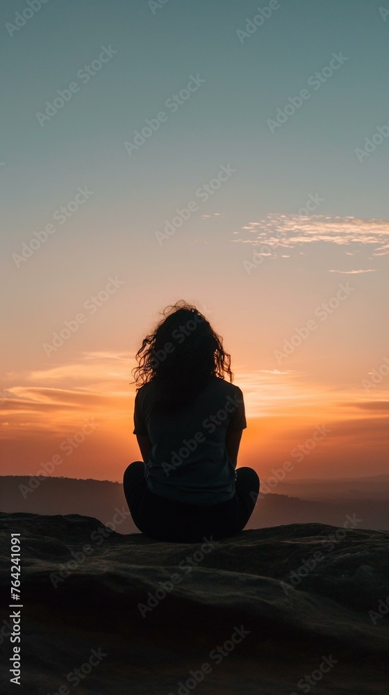 Serene Sunset Meditation on Mountain Cliff - Woman Embracing Peace