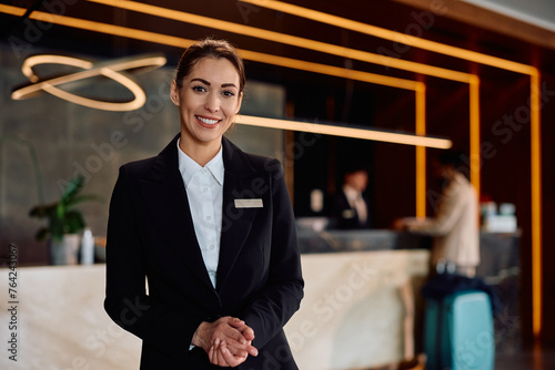 Portrait of smiling female hotel manager looking at camera.
