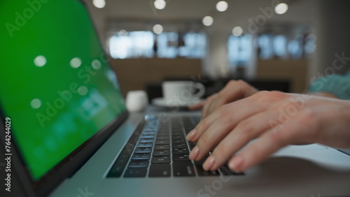 Executive arms pushing buttons at green screen computer. Woman typing laptop