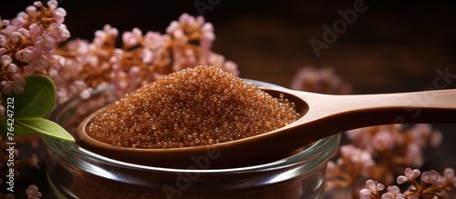 Spoon with brown sugar and flowers
