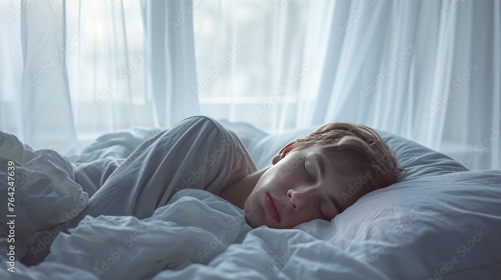 A 30-year-old man sleeps on a white bed. A 30-year-old man sleeps on a white bed.