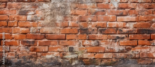 Close-up view of a weathered brick wall with a concrete block