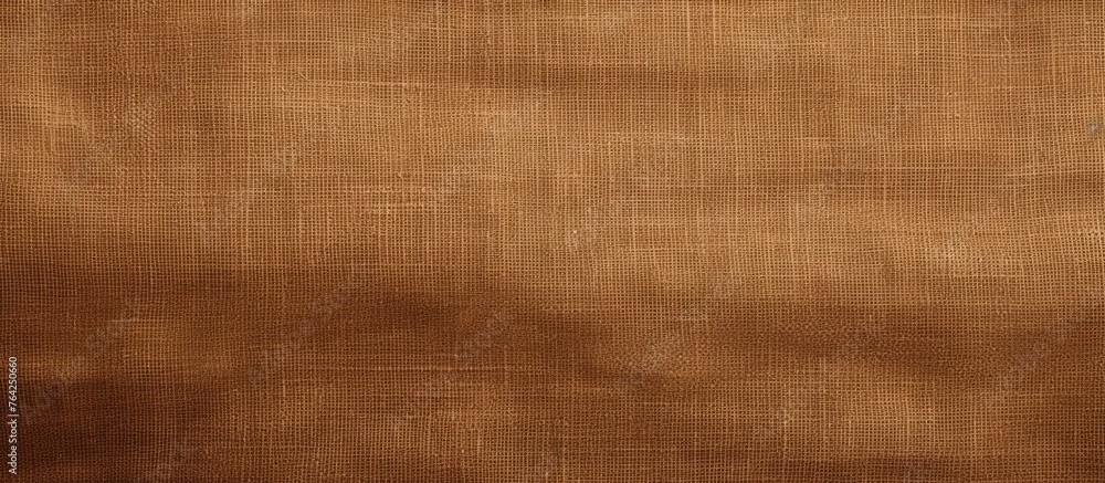 Fototapeta premium Brown fabric with a tiny hole close up