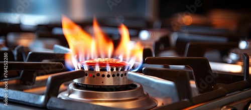 Gas stove flames burning in a kitchen