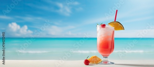Drink on beach with straw and orange slice