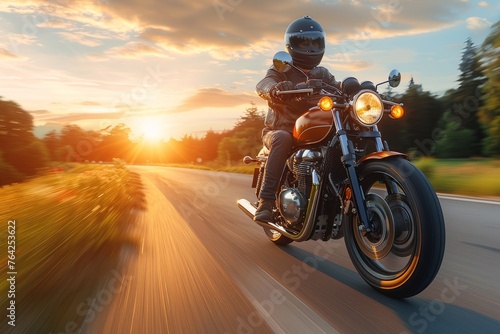 A motorcyclist enjoys the freedom of the open road at sunset, embodying the spirit of adventure and exploration