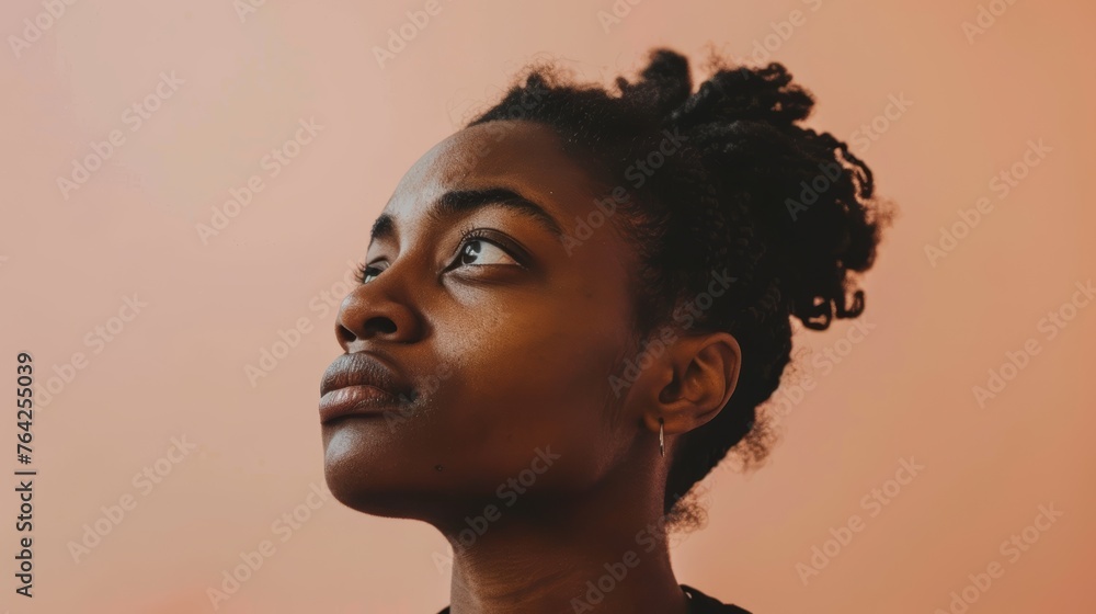 Side profile portrait of a young woman with updo hair. Studio shot with pink gradient background. Beauty and elegance concept. - obrazy, fototapety, plakaty 