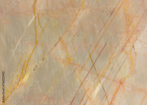 texture of pink marble with veins and colored splashes close-up