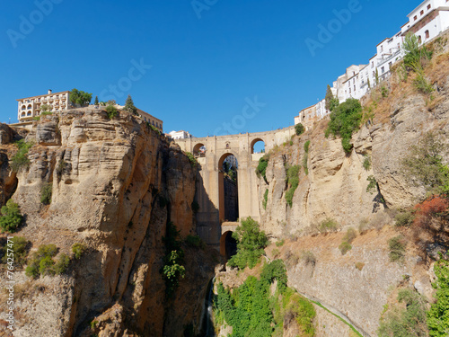 The Puente Nuevo, New Bridge in Ronda. White villages in the province of Malaga, Andalusia, Spain. Beautiful village on the cliff of the mountain. Touristic destination. Holidays and enjoy the sun. © stu.dio
