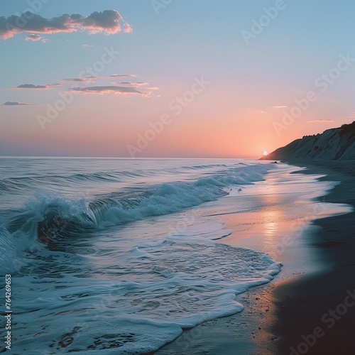 a beautiful shot of a calm beach taken at dusk that highlights the tranquility and beauty of the sea. © Hamza