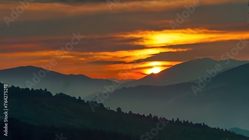 A sunset over a mountain range.