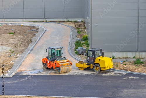 Two Road Rollers at Construction Site New Factory Building