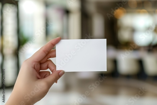 Blank Business Card in Hand with Urban and Indoor Backgrounds for Marketing and Branding