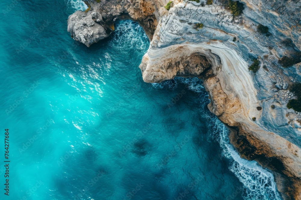 Aerial View of a Body of Water Near a Cliff, A cinematic shot from above of a turquoise sea and weathered cliffs, AI Generated