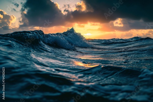 The sun is seen setting on the horizon, casting a warm golden glow across the ocean waves as they crash against the shore, A dynamic ripple of ocean waves during twilight, AI Generated