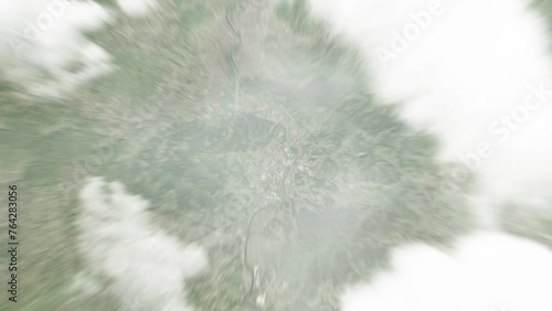 Earth zoom in from space to Doboj, Bosnia and Herzegovina. Followed by zoom out through clouds and atmosphere into space. Satellite view. Travel intro. Images from NASA photo