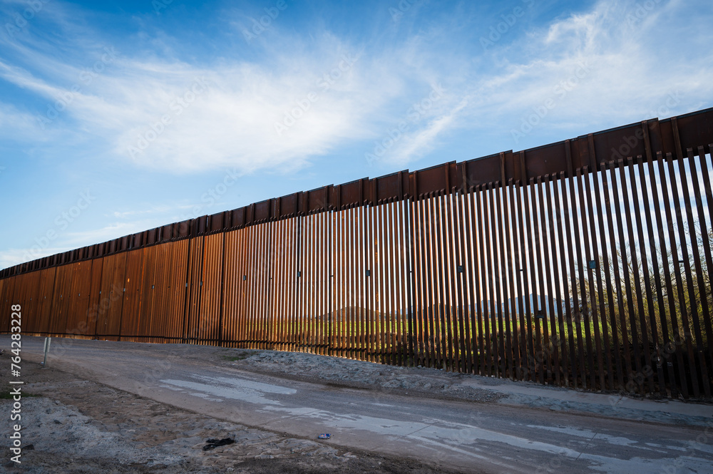 The US border wall between Lukeville Arizona and Sonoyta Mexico. The US border wall between Lukeville Arizona and Sonoyta Mexico.