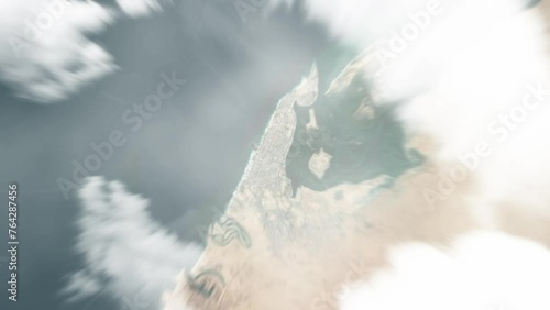 Earth zoom in from space to Umm Al Quwain, United Arab Emirates. Followed by zoom out through clouds and atmosphere into space. Satellite view. Travel intro. Images from NASA photo