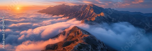 Sunrise Over Mountain Peaks Above a Sea of Clouds