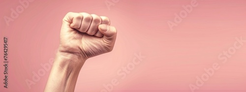 Female fist, gender female sign on pink background. Woman showing fist as girl power symbol. Parades and manifestos, pride and solidarity. Demonstration, revolution, protest raised. 8 March concept