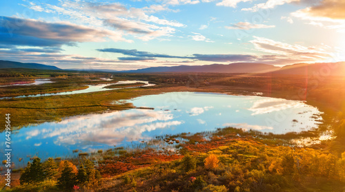 Lake and landscape at colorful sunrise. Newfoundland, Canada