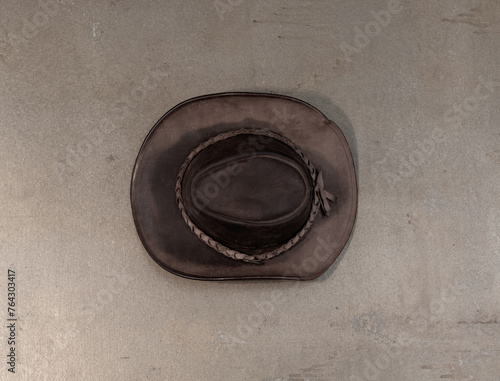 old leather cowboy hat on old background