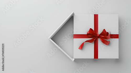 Gift box with red ribbon isolated on white background, copy space, aerial view 