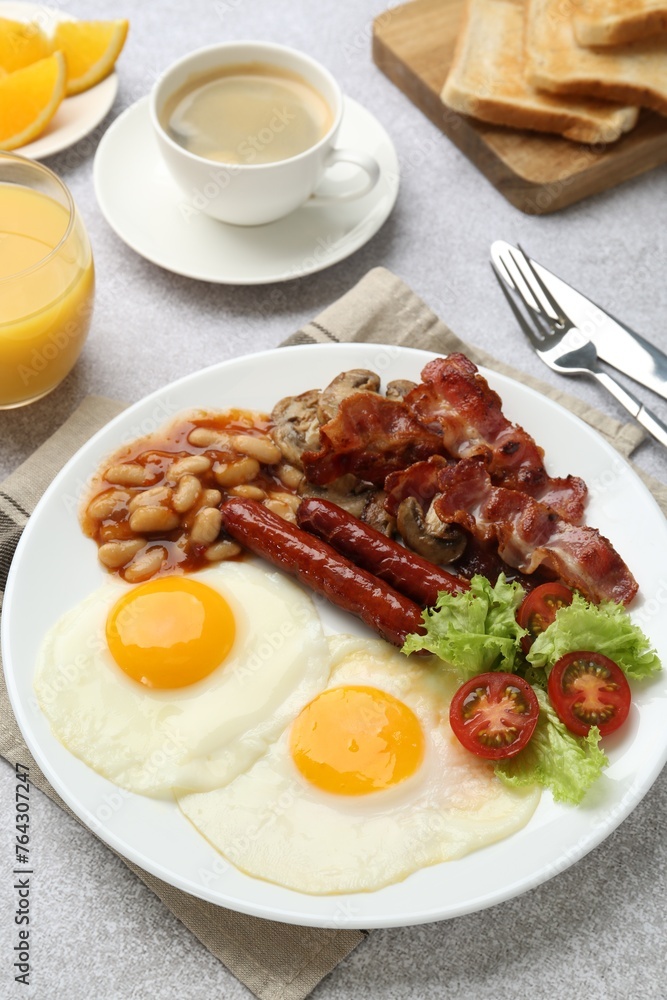 Delicious breakfast with sunny side up eggs on light table Delicious breakfast with sunny side up eggs on light table